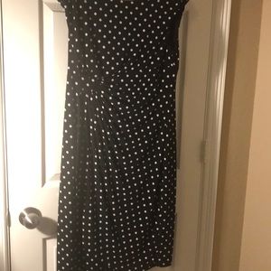 Black polkadot dress with gathered pleats.